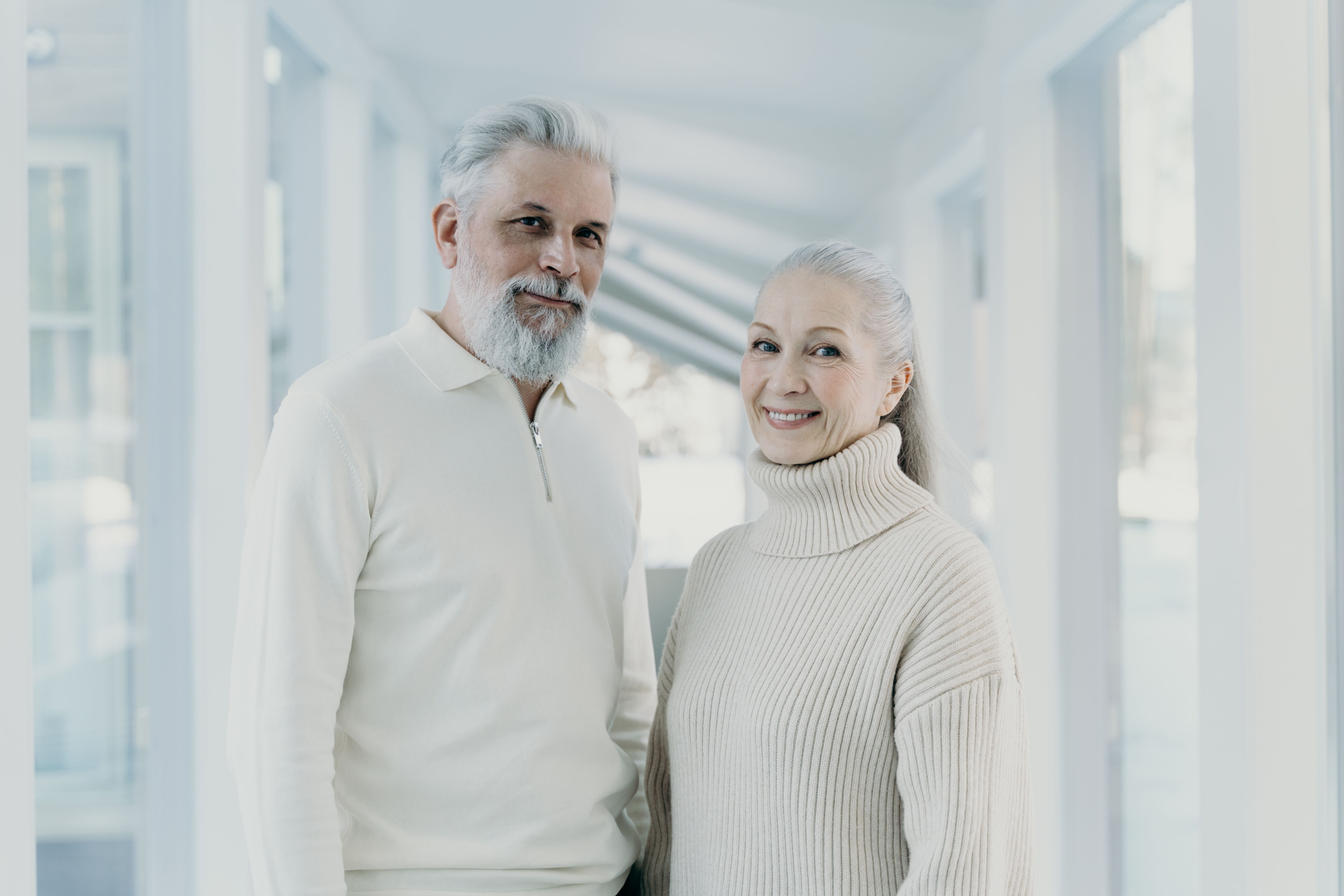 An older couple together in a bright, welcoming space